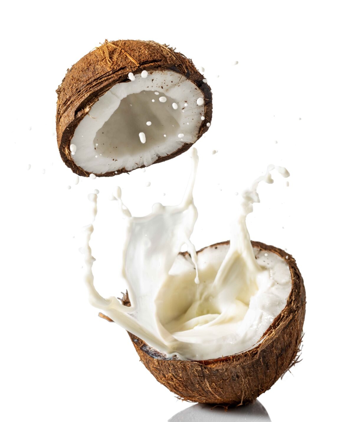 Dehusked and whole Indian coconuts prepared for global shipment by RDS ENTERPRISES.