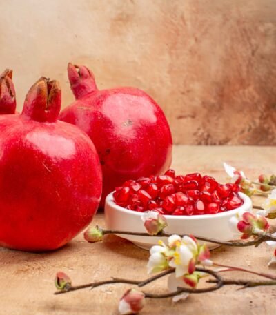 Juicy Indian pomegranates with red arils ready for international export by RDS ENTERPRISES.