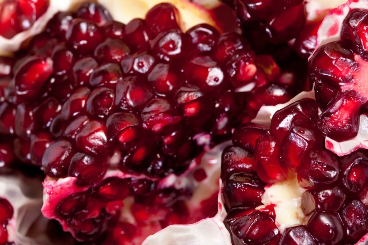 Juicy Indian pomegranates with red arils ready for international export by RDS ENTERPRISES.