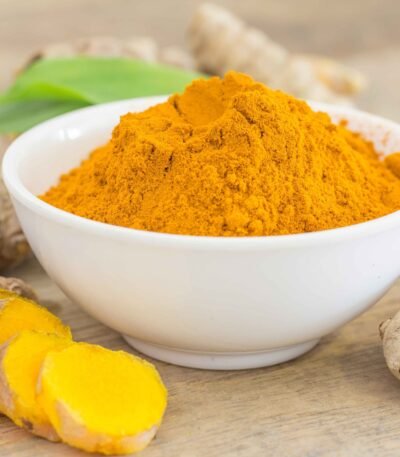 Bright yellow turmeric fingers and powder exported by RDS ENTERPRISES for food and medicinal use.